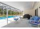 Relaxing screened patio with outdoor furniture, a barbecue grill, and a view of the pool at 1322 Ensenada Dr, Orlando, FL 32825