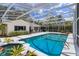 A screened in pool featuring a built in hot tub and ample deck space for entertaining friends and Gathering at 1322 Ensenada Dr, Orlando, FL 32825