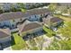 Overhead view of townhomes with attached garages, showcasing well-maintained lawns and community layout at 1325 Seburn Rd, Apopka, FL 32703