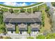 Aerial view showcasing townhouse community with manicured lawns, parking, and mature landscaping at 1325 Seburn Rd, Apopka, FL 32703