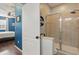 Modern walk-in shower featuring glass doors and stylish tile in the primary bathroom at 1325 Seburn Rd, Apopka, FL 32703