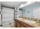 Well-lit bathroom features a double sink vanity, decorative mermaid theme, and a shower-tub combo at 1325 Seburn Rd, Apopka, FL 32703