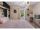 Stylish bedroom with a four-poster bed, soft pink decor, and cozy accents for a relaxing atmosphere at 1325 Seburn Rd, Apopka, FL 32703