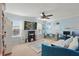 Bright bedroom featuring neutral walls, a ceiling fan, and ample natural light from two windows at 1325 Seburn Rd, Apopka, FL 32703