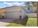 Two-car garage exterior with updated curb appeal, exterior lighting, and landscaping at 1325 Seburn Rd, Apopka, FL 32703
