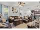 Cozy living room featuring comfortable seating, open layout to the kitchen, and bright natural light at 1325 Seburn Rd, Apopka, FL 32703
