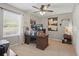 Well-lit home office featuring a large wooden desk, comfortable chair, and ample space for productivity at 1325 Seburn Rd, Apopka, FL 32703