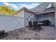 Private outdoor patio featuring brick pavers, string lights, barbecue, and privacy fencing at 1325 Seburn Rd, Apopka, FL 32703