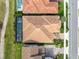 Bird's eye view of the residence showing the roof, screened-in pool, meticulous landscaping and street access at 13346 Alderley Dr, Orlando, FL 32832