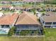 Aerial view showcases this property's tile roof, screened pool and tropical landscaping in an attractive neighborhood at 13346 Alderley Dr, Orlando, FL 32832