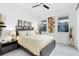 Bedroom features a ceiling fan and large windows that bring in natural light at 13346 Alderley Dr, Orlando, FL 32832