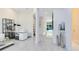 Hallway offers sight lines to the pool with modern decor at 13346 Alderley Dr, Orlando, FL 32832