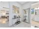 Hallway featuring modern decor with entryways to a bedroom and bathroom at 13346 Alderley Dr, Orlando, FL 32832