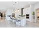 Bright modern kitchen with an island, bar seating, stainless steel appliances, and ample cabinet space at 13346 Alderley Dr, Orlando, FL 32832