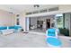 Covered patio with tiled flooring, ceiling fans, comfortable seating, and an indoor/outdoor feel at 13346 Alderley Dr, Orlando, FL 32832