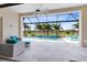 Screened-in pool area with outdoor seating, water features, and privacy landscaping with palm trees at 13346 Alderley Dr, Orlando, FL 32832