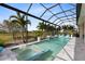 Relax in this fabulous screened-in pool and spa with a water feature and comfortable lounge chairs at 13346 Alderley Dr, Orlando, FL 32832