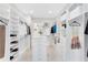 Spacious walk-in closet with custom shelving, drawers, and ample storage space at 13346 Alderley Dr, Orlando, FL 32832