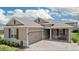 Charming single-story home featuring a brick-paved driveway, two car garage and lovely front porch at 14500 Black Quill Dr, Winter Garden, FL 34787