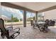 Covered patio with brick pavers, elegant furniture and community views at 14500 Black Quill Dr, Winter Garden, FL 34787