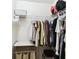 Walk-in closet with organized clothing racks and storage bins for efficient organization at 1549 Balsam Willow Trl, Orlando, FL 32825