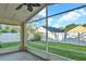 Relax on this screened lanai, with a view of the fenced yard and mature trees in the background at 1600 Riveredge Rd, Oviedo, FL 32766