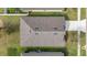 Overhead angle of roof shows shingles, house dimensions and landscaping of the lot at 16140 Yelloweyed Dr, Clermont, FL 34714