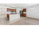Open kitchen featuring stainless steel appliances, granite countertops, and a breakfast bar at 16140 Yelloweyed Dr, Clermont, FL 34714