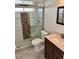 Full bathroom displaying a shower with patterned tile, and vanity with sink at 1623 Bridgeview Cir, Orlando, FL 32824