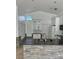 Bright kitchen with white cabinets, granite countertops, stainless steel appliances, and a stone island at 1623 Bridgeview Cir, Orlando, FL 32824