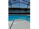 A refreshing screened-in pool provides a beautiful lake view at 1623 Bridgeview Cir, Orlando, FL 32824