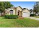 Charming single-Gathering home with a well-maintained lawn, beautiful shrubs, and a two-car garage at 1669 Slash Pine Pl, Oviedo, FL 32765