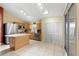 Open kitchen with island, stainless steel appliances, and closet pantry at 1669 Slash Pine Pl, Oviedo, FL 32765