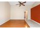 Neutral living room features wood floor and neutral colored walls at 1669 Slash Pine Pl, Oviedo, FL 32765