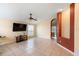 Spacious living room with tile floors, a ceiling fan, and ample natural light at 1669 Slash Pine Pl, Oviedo, FL 32765