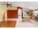 Open-concept living space, featuring a kitchen with a center island and tile flooring at 1669 Slash Pine Pl, Oviedo, FL 32765