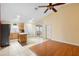 Open-concept living space, featuring a kitchen with a center island and tile flooring at 1669 Slash Pine Pl, Oviedo, FL 32765