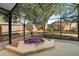 Relaxing screened-in patio featuring a built-in hot tub and private backyard at 1669 Slash Pine Pl, Oviedo, FL 32765