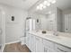 Bathroom featuring double sink vanity, large mirror and walk-in shower at 1848 Napoli Dr, St Cloud, FL 34771