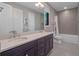 Modern bathroom with dual sinks, large mirror, and shower/tub combination at 1970 Laurel Rd, Winter Park, FL 32789