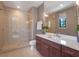 Modern bathroom featuring glass enclosed walk-in shower and dark wood vanity with a light countertop at 1970 Laurel Rd, Winter Park, FL 32789