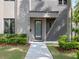 Close-up of the home's entrance, showcasing the walkway and professionally maintained landscaping at 1970 Laurel Rd, Winter Park, FL 32789