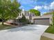 Contemporary home featuring a clean design with a concrete driveway and neutral color palette creating a modern curb appeal at 1970 Laurel Rd, Winter Park, FL 32789