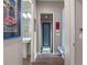Hallway view looking toward a bathroom and a doorway leading to an outdoor garden at 1970 Laurel Rd, Winter Park, FL 32789