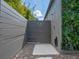 Outdoor shower for rinsing off after enjoying the pool or yard with privacy from the surrounding gray fence at 1970 Laurel Rd, Winter Park, FL 32789