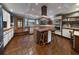 Stylish kitchen with tile flooring, island cooktop, and modern appliances at 2020 Venetian Way, Winter Park, FL 32789
