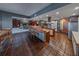 Open kitchen includes stainless steel appliances and an adjacent dining and living area at 2020 Venetian Way, Winter Park, FL 32789