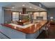 Open kitchen with wood countertops, stainless steel appliances, and updated cabinetry at 2020 Venetian Way, Winter Park, FL 32789