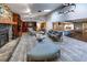 Sunlit living room with fireplace, bar, and seamless transition to the modern kitchen at 2020 Venetian Way, Winter Park, FL 32789