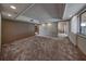 Carpeted living room with view of hallway toward bedroom and recessed ceiling lights at 2020 Venetian Way, Winter Park, FL 32789